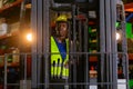 Man african american wear safety holding walkie talkie driver forklift warehouse in factory. Male worker industrial operate. Royalty Free Stock Photo