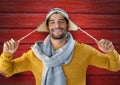 Man against wood with warm hat and scarf Royalty Free Stock Photo