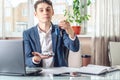 Man agent passes the car keys to the client in the office. Concept of buying selling and rental of transport Royalty Free Stock Photo