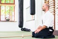 Man at Aikido martial arts with wooden sword Royalty Free Stock Photo