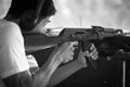 Man aiming a gun at the shooting range, target practicing Royalty Free Stock Photo