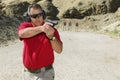 Man Aiming Hand Gun At Firing Range Royalty Free Stock Photo