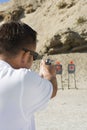 Man Aiming Hand Gun At Firing Range Royalty Free Stock Photo