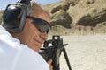 Man Aiming Machine Gun At Firing Range Royalty Free Stock Photo