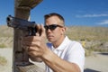 Man Aiming Machine Gun At Firing Range