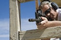 Man Aiming Machine Gun At Firing Range Royalty Free Stock Photo