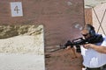 Man Aiming Machine Gun At Firing Range