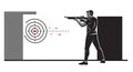 Man aiming a rifle at a target in a shooting range. The target features concentric Royalty Free Stock Photo