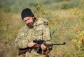 Man aiming target nature background. Hunter hold rifle. Aiming skills. Hunting permit. Bearded hunter spend leisure Royalty Free Stock Photo