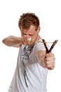 A man aims a slingshot Royalty Free Stock Photo