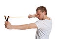 A man aims a slingshot