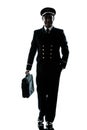 Man in airline pilot uniform silhouette walking