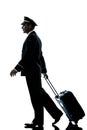 Man in airline pilot uniform silhouette walking