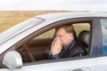 Man allergic to grass pollen runny nose in car Royalty Free Stock Photo