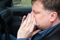 Man allergic to grass pollen runny nose in car Royalty Free Stock Photo