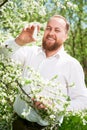 Man allergic using medical nasal drops, suffering from seasonal allergy at spring Royalty Free Stock Photo