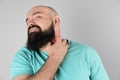 Man with allergy symptoms scratching neck Royalty Free Stock Photo
