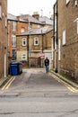 Man Alone Taking Short Cut Through A Narrow Alley Using Mobile Phone