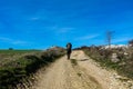 Man alone on the Way - The french Way of `Camino de Santiago` in Winter. Pilgrimages on their journey through Spain Royalty Free Stock Photo