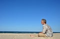 A man alone on white sandy beach Royalty Free Stock Photo