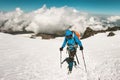 Man alpinist climbing in mountains