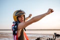 Man in american flag cape with hands up in air Royalty Free Stock Photo