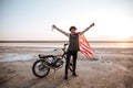Man in american flag cape with hands up in air Royalty Free Stock Photo