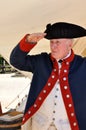 Man in American Revolutionary War attire salutes