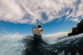 man with an amputated hand ride the wave on wakeboard