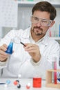 man analysing and evaluating molecules in chemistry lab Royalty Free Stock Photo