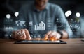 Man analyzing dynamic data displays using a digital tablet Royalty Free Stock Photo