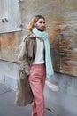 Man with antique pink trousers and beige coat before Marni fashion show, Milan Fashion Week