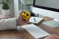 Man with antistress ball at desk in office, closeup