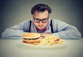 Man anxious about unhealthy fast food Royalty Free Stock Photo