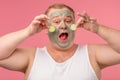 Man applies a mask of clay to cleanse the skin Grooming and skin care concept.
