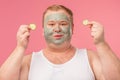 Man applies a mask of clay to cleanse the skin Grooming and skin care concept.