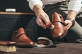 Man applies shoe polish Royalty Free Stock Photo