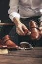 Man applies shoe polish Royalty Free Stock Photo