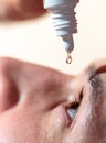 Man applying eyedrops