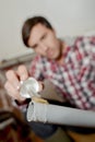 Man applying glue to end pvc pipe