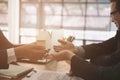 man applying for mortgage loan with bank employee. client signing contract document with realtor at real estate agency. Royalty Free Stock Photo