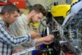 man with apprentice fixing bike Royalty Free Stock Photo