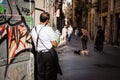 Barkeeper having his break standing in a street of Barcelona