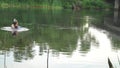 A man in the aqualung emerges from the river