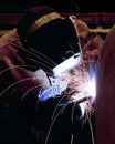 A professional welder, welding the top on a pressure vessel Royalty Free Stock Photo