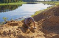 A man archaeologist carefully digs out a layer of soil in search of finds