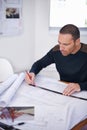 Man, architect and floor plan or drawing design as property blueprint with ruler for planning, drafting or engineering Royalty Free Stock Photo