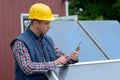 man architect in helmet working at tablet outdoors Royalty Free Stock Photo