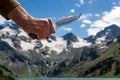 Man arm holding knife over nature Royalty Free Stock Photo