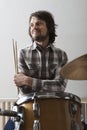 Man With Arms Crossed Sitting Near Drumset Royalty Free Stock Photo